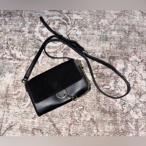 Moda Luxe Black Crossbody Bag with Gold Accent